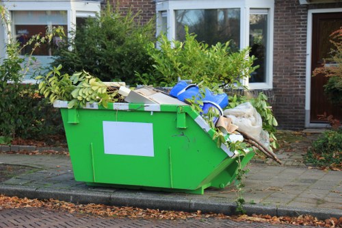 Operators sorting waste during a home clearance